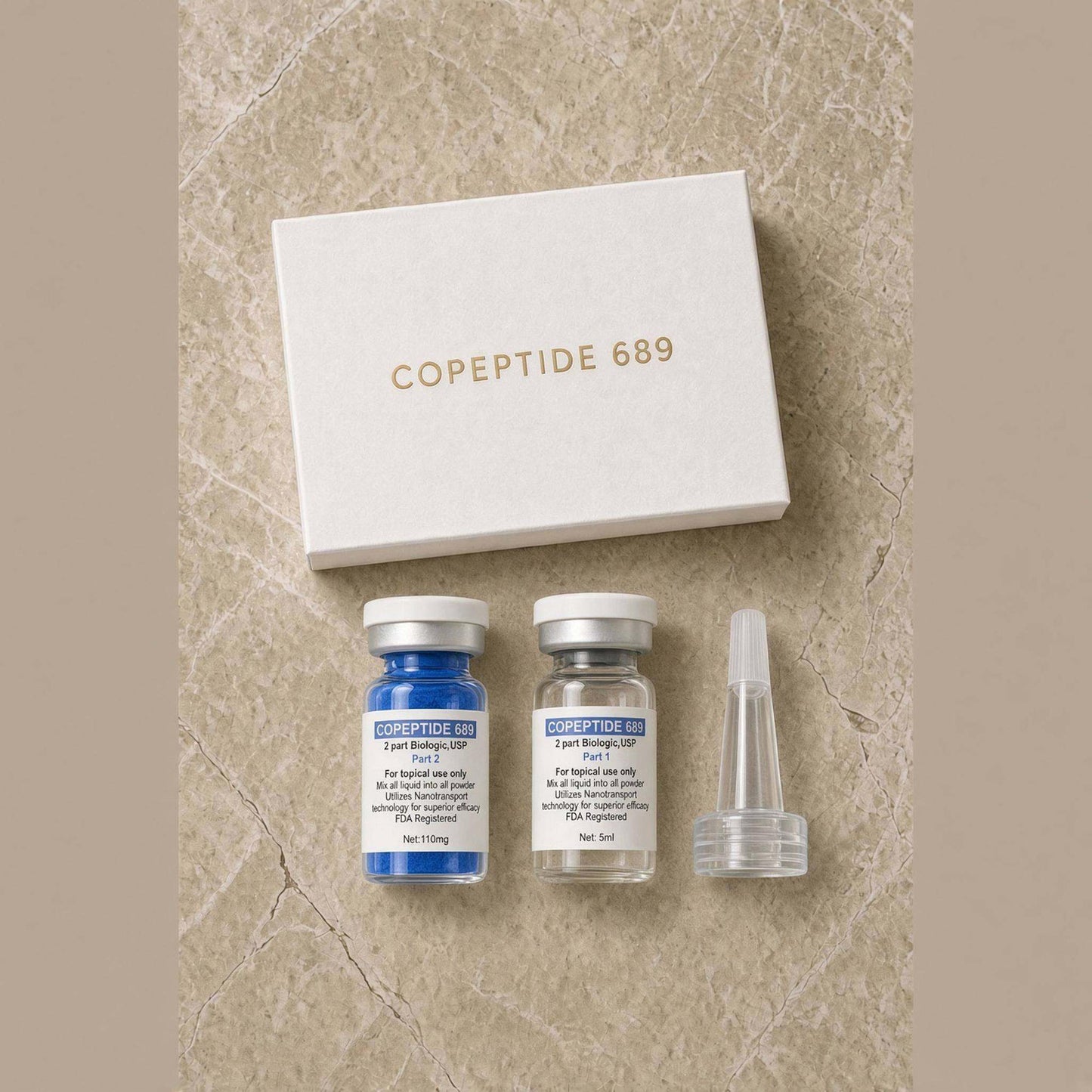 
                  
                    Two-part copper peptide serum vials beside their box on a marble surface
                  
                