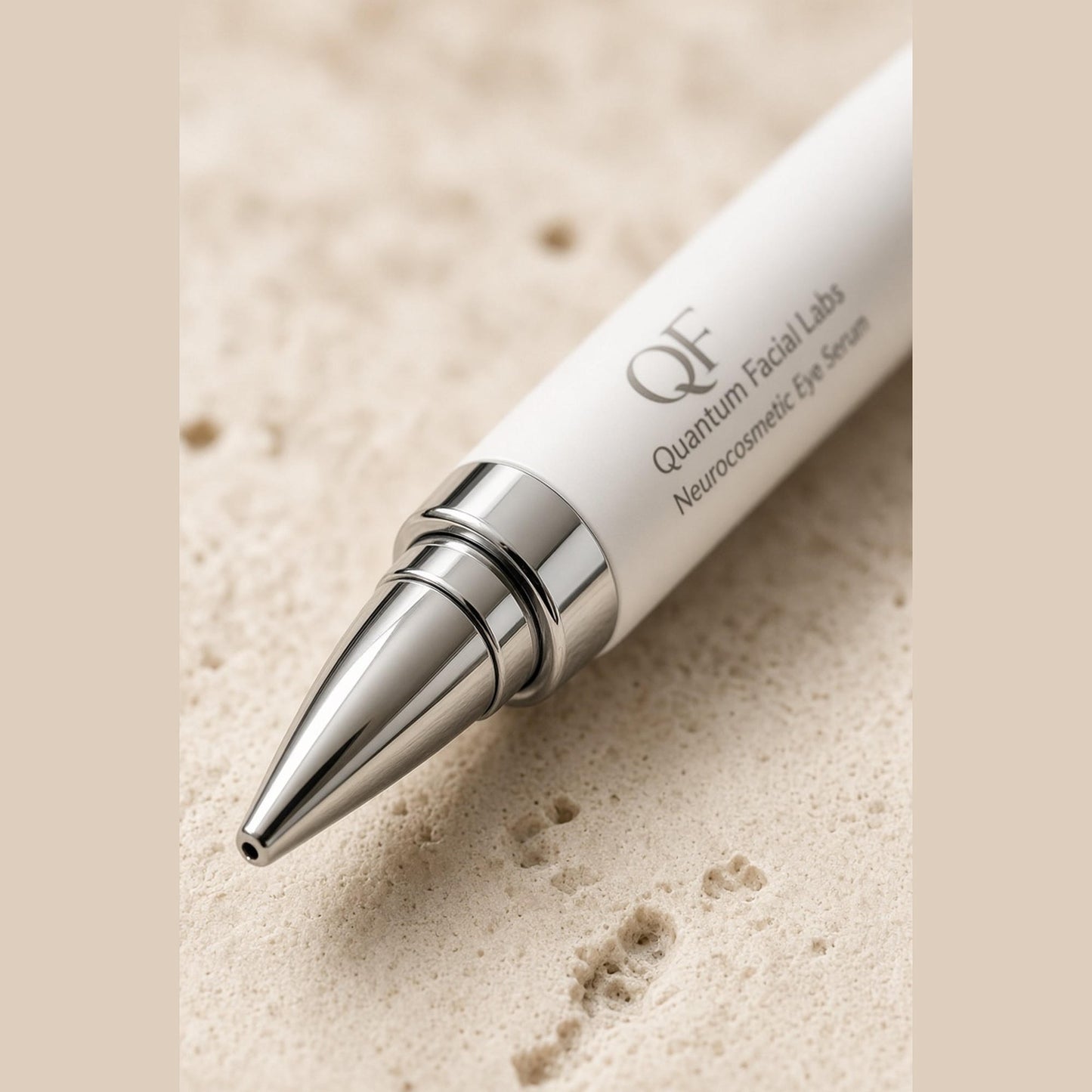 
                  
                    Close-up of the steel rollerball tip on a peptide under-eye serum applicator
                  
                